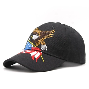 Detailed close-up of eagle and American flag embroidery on a black cotton baseball cap