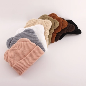 Collection of knit baby winter hats with bear ears shown in eight different colors