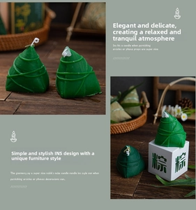 Macro shot of green zongzi-shaped scented candle with realistic woven leaf texture