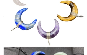 Detail of wire-wrapped crescent moon gemstones in amethyst, lapis, and tiger eye pendants