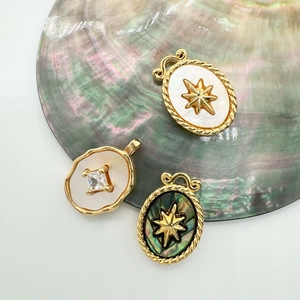 Vintage 18K gold plated shell pendants with star motifs and sparkling zircon accents