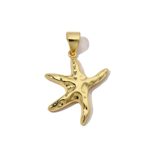 Macro shot of gold starfish pendant with lifelike texture and metal hanging loop
