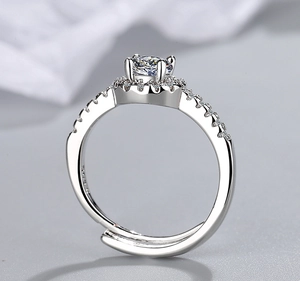 Macro shot of silver adjustable wide ring with large central cubic zirconia and side pave
