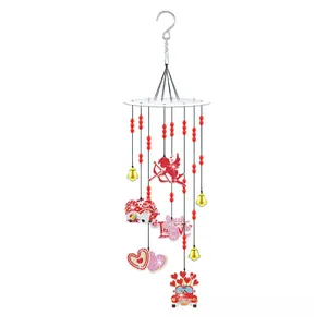 Detailed close-up of DIY Valentine's diamond painting wind chime with hearts and beads