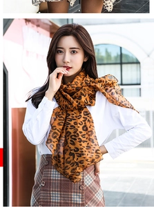 Detailed view of lightweight leopard print silk scarf on a model for casual spring style