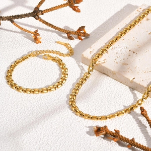 Minimalist gold watchband style necklace and bracelet set in stainless steel texture
