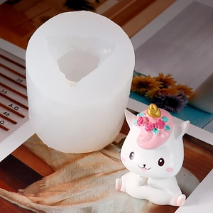 Detailed silicone mold with a finished 3D unicorn rabbit statue for DIY candle making