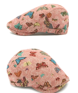Detail view of woven jacquard butterfly patterns and adjustable metal buckle on back