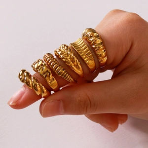 Set of six vintage twisted gold stainless steel rings for women with various textures