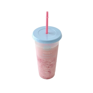 Large capacity plastic straw cup with blue lid and pink drink on white background