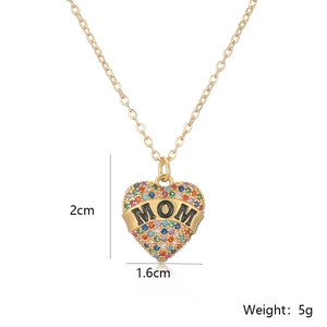 Detail view of 18K gold plated heart necklace with zircon inlay and MOM lettering