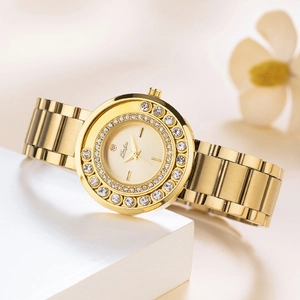 Detailed macro of gold stainless steel watch with diamond bezels on minimalist geometry