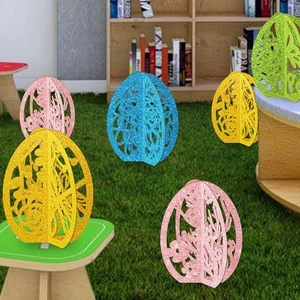 3D glitter hollow Easter egg ornaments in colorful pink, yellow, blue, and green finishes