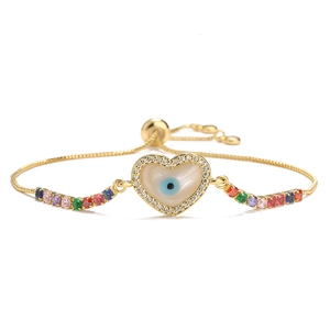 Detailed view of evil eye heart charm bracelet with colorful rainbow zircon stones