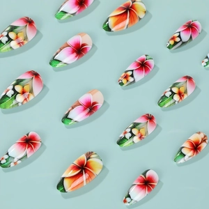 Floral almond press on nails with tropical frangipani patterns on light blue background
