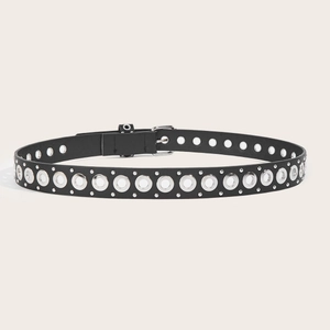 Punk style black leather belt with double silver eyelets and chain on beige background