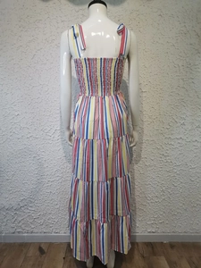 Detail of the tie-up shoulder straps and elastic ruched back of the striped dress