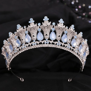 Elegant silver Baroque bridal crown with light blue crystals and rhinestones on black fabric
