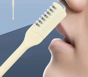 Close-up of portable dual-head nose hair trimmer with safety comb teeth guard design
