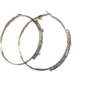 Chic silver hoop earrings with shimmering crystals set on a clean white background