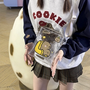 Detail of transparent PVC crossbody bag with cute cartoon capybara print and adjustable strap
