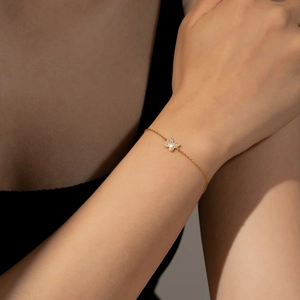 Elegant 925 sterling silver butterfly bracelet with shimmering zircons on female wrist