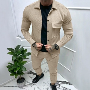Detail of men's beige ribbed texture long sleeve shirt and slim pants set