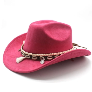 Detail of rose red suede cowboy hat with shell decor, white fringe and silver pendant