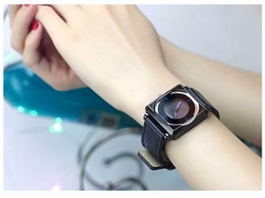 Close-up of minimalist square watch with purple accents and black leather strap worn on wrist