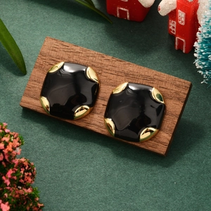 Vintage black square earrings with 14K gold plated accents on a festive holiday backdrop