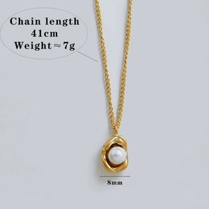 Elegant gold stainless steel necklace with irregular pendant and a white 8mm pearl
