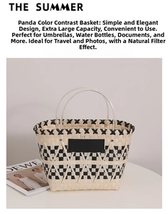 Detailed view of handmade woven straw tote with round handles and leather patch on white stand