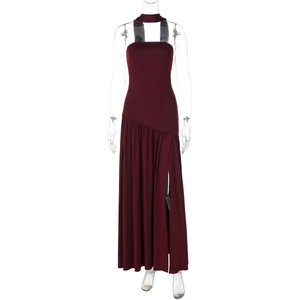 Detail view of burgundy halter dress featuring waist pleats and a sexy side slit detail