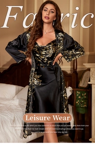 Detail of floral print satin sleepwear set with black long sleeve robe and matching slip dress