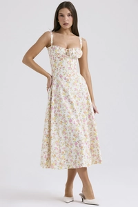 Detail of floral spaghetti strap midi dress with pink and orange flowers on grey background