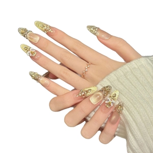 Luxurious handmade press-on nails with champagne gold glitter, rhinestones and pearls