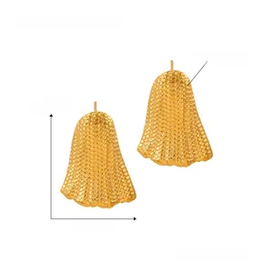 Detail view of 2.6cm titanium steel earrings with textured 18K gold-plated surface