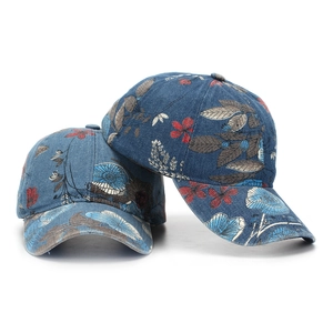 Denim baseball cap with vintage floral print in blue and red on white background
