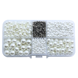 White faux pearl DIY craft kit with silver metal clasps in a transparent storage box