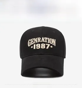 Detailed view of 1987 embroidery on a black cotton baseball cap with a curved brim