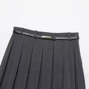 Dark grey pleated skirt with a black leather belt and gold buckle on a white background