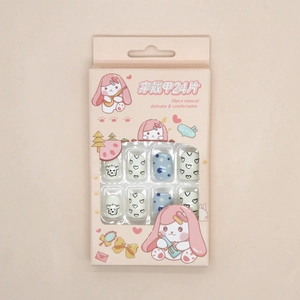 Detail of 24pcs blue sky press-on nails featuring cute puppy and heart patterns in a box