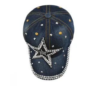 Top view of washed denim baseball cap featuring rhinestone star and metal stud accents