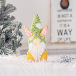 Plush Easter gnome with rabbit ears and green pointed hat for festive tabletop decoration
