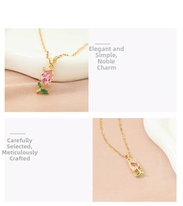 Macro detail of tulip necklace with pink water-drop gemstone and green leaf accents