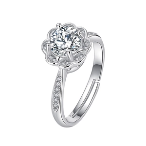 Macro shot of silver ring featuring flower halo setting and adjustable open band