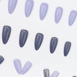Almond-shaped purple glitter press-on nails with minimalist gold metallic line accents