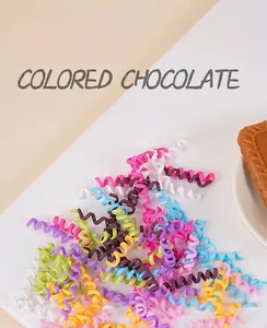 Detailed view of colorful spiral polymer clay chocolate rolls for DIY dessert decoration