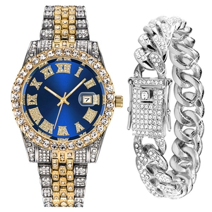Close-up of hip hop jewelry set with crystal-studded watch and iced out Cuban bracelet