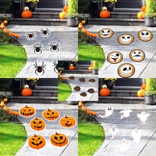 Outdoor Halloween decor showing pumpkin, ghost, and spider stickers on stairs path